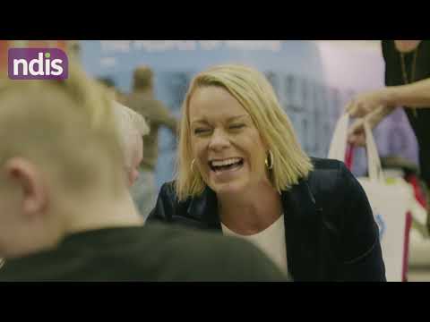 Lady sitting at a table laughing