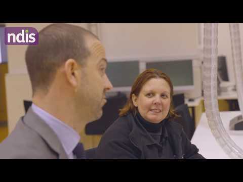 Man sitting next to a woman